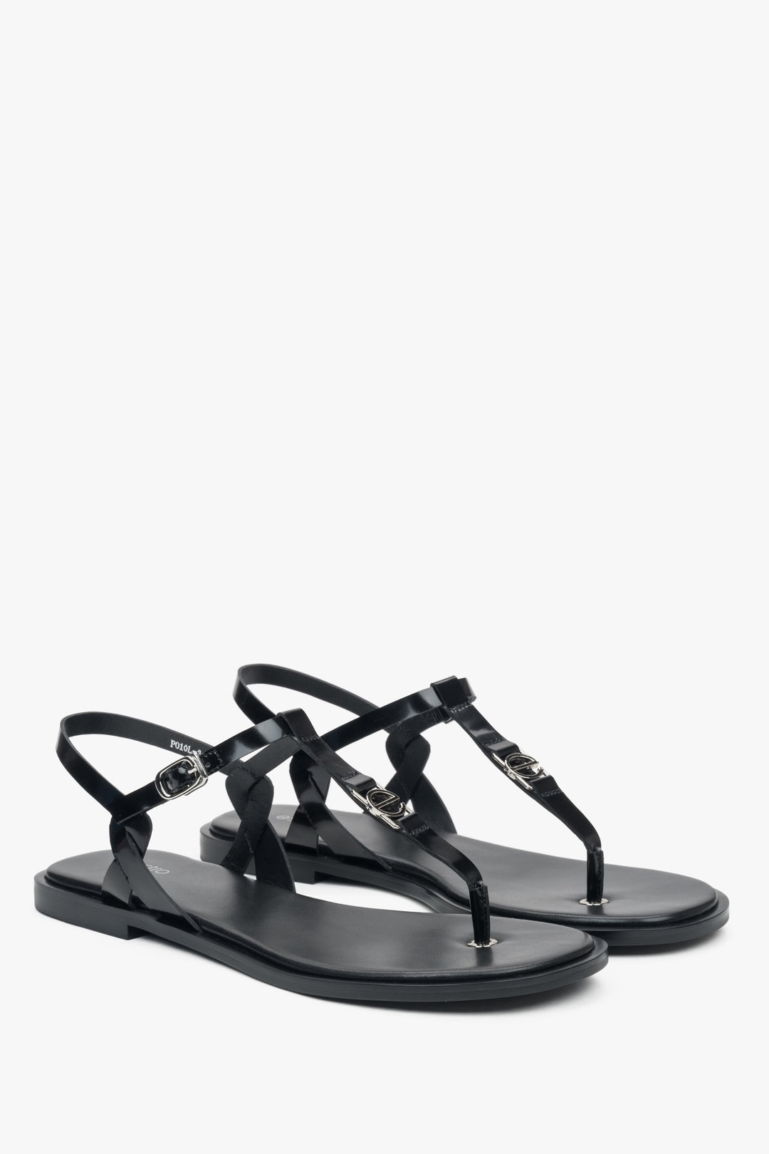 Black leather women’s flip-flop sandals with a flat sole.