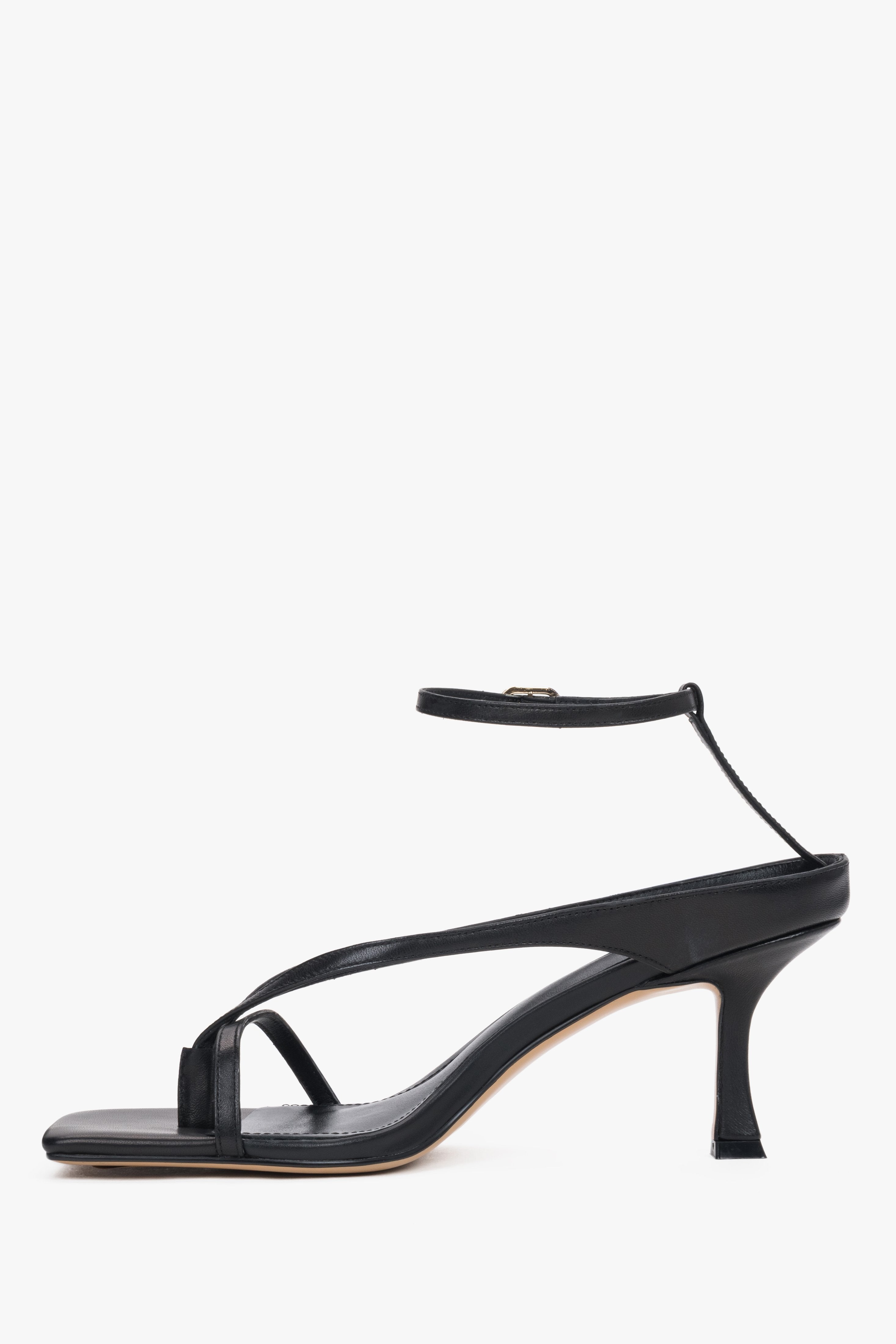 Black leather thong-strap heeled sandals with a square toe, summer style.