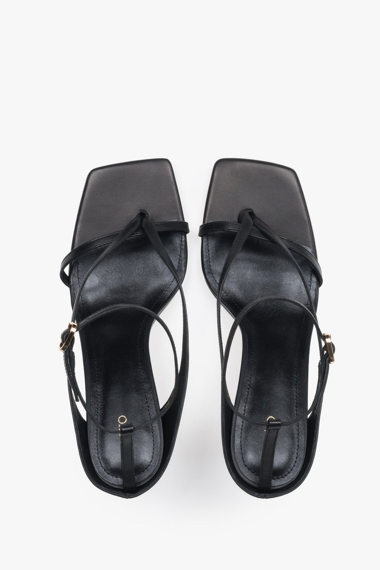 Elegant black sandals with thin straps, made of genuine leather, 7.5 cm heel – top view.
