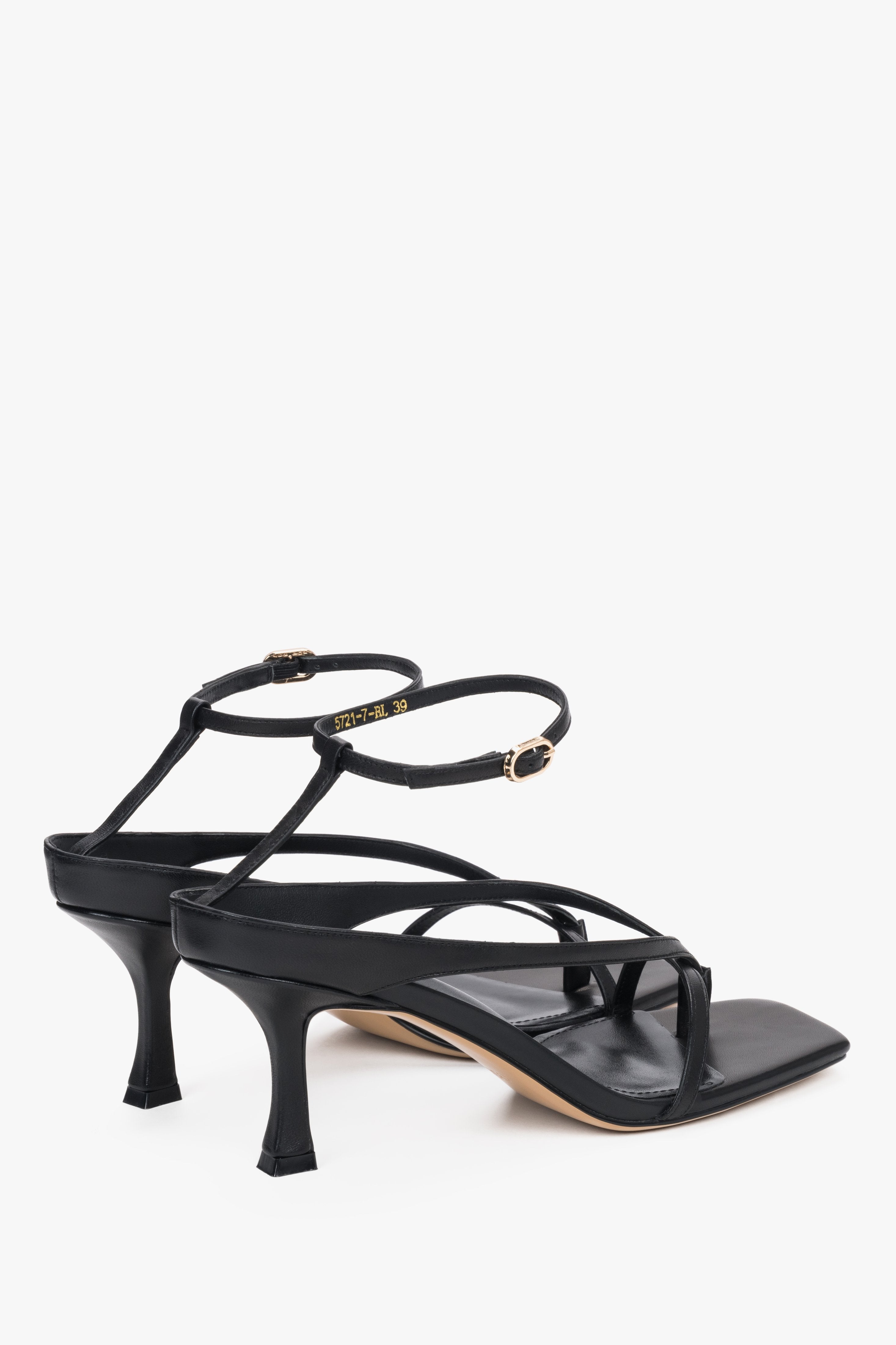 Minimalist Estro thong sandals, black leather, stable sculpted heel – heel view.
