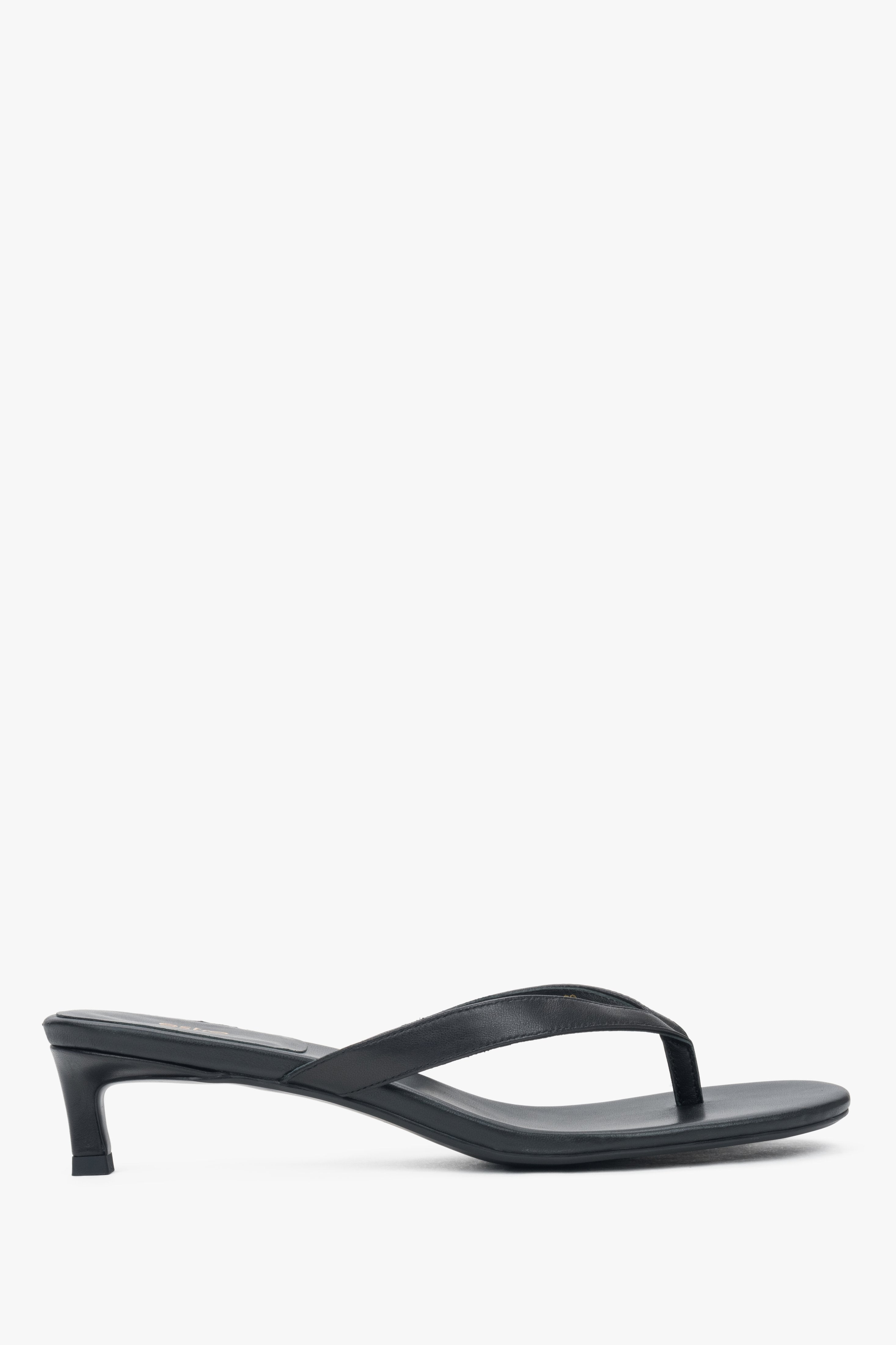 Women’s black leather thong sandals with a low heel by Estro.