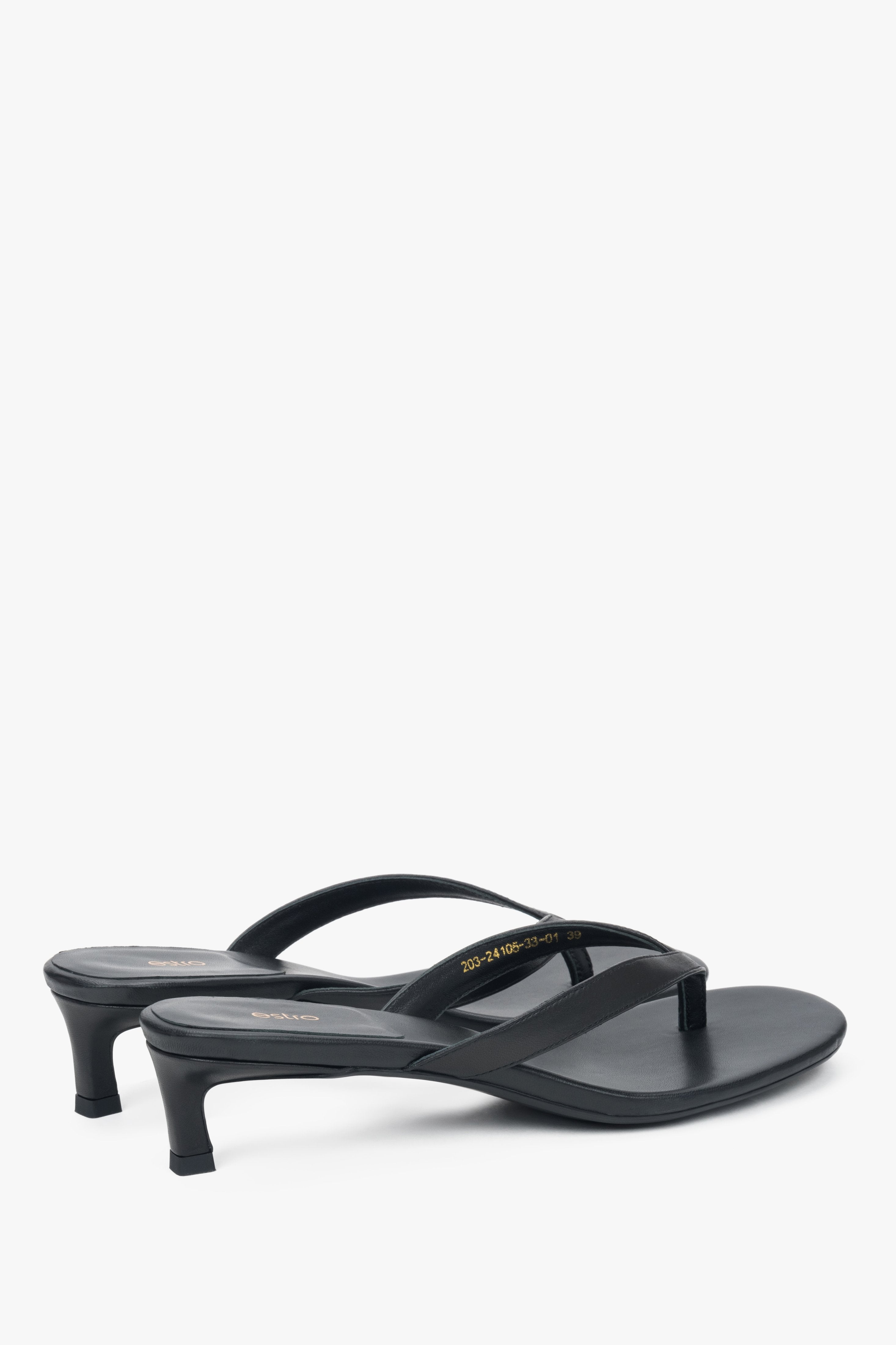 Women’s black leather thong sandals with a low heel by Estro.