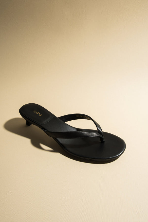 Women’s black thong sandals with a low heel by Estro.