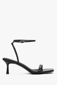 Women's black leather funnel heel sandals by Estro with silver details.