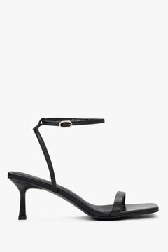 Women's black leather funnel heel sandals by Estro with silver details.
