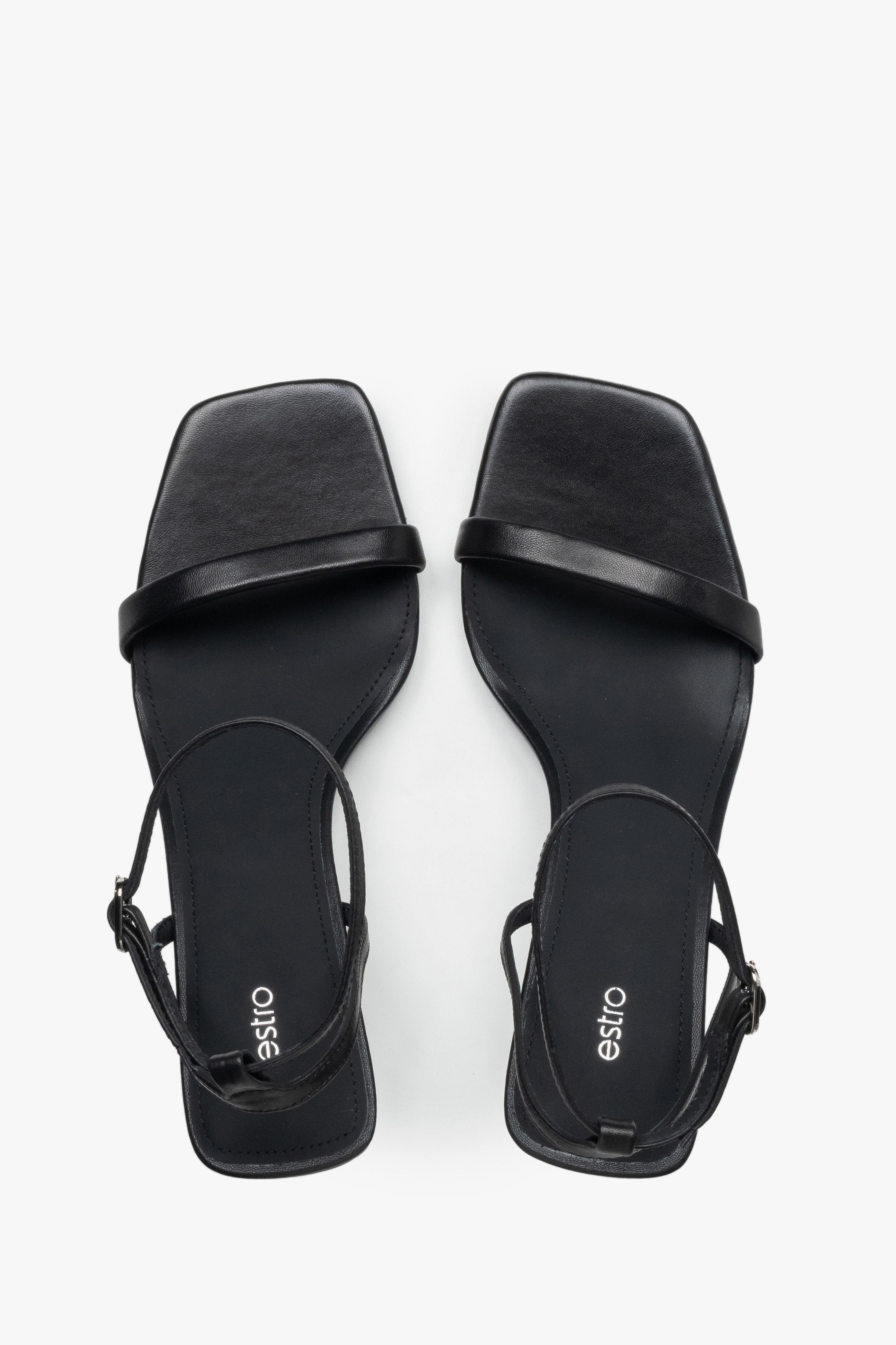Top view of women's black leather funnel heel sandals by Estro.