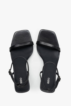 Top view of women's black leather funnel heel sandals by Estro.