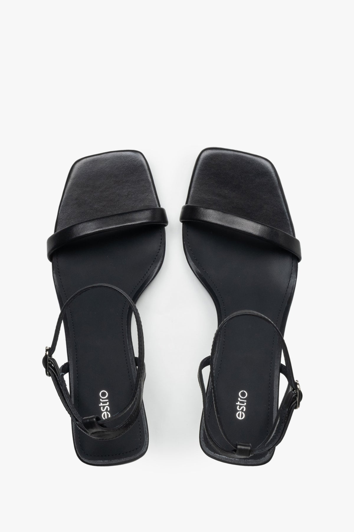 Top view of women's black leather funnel heel sandals by Estro.