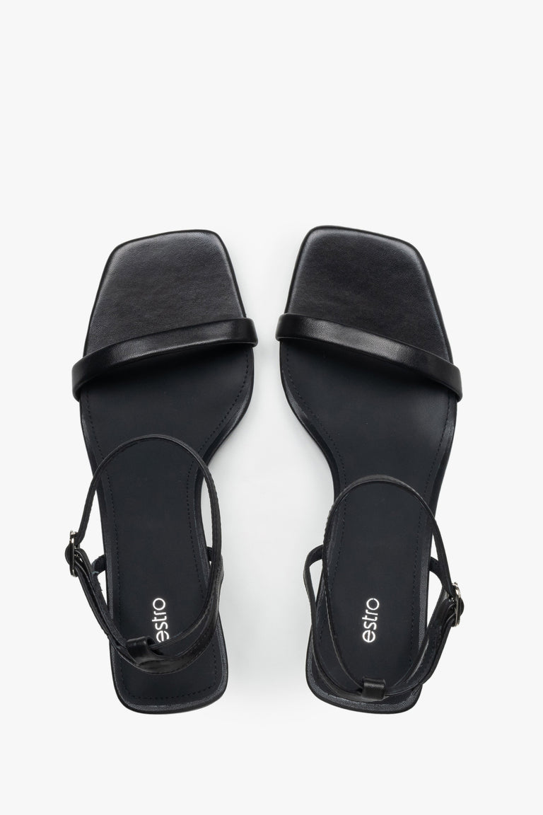 Top view of women's black leather funnel heel sandals by Estro.