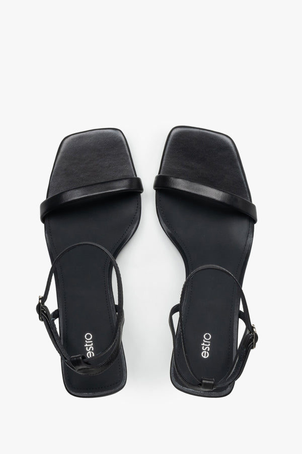 Top view of women's black leather funnel heel sandals by Estro.
