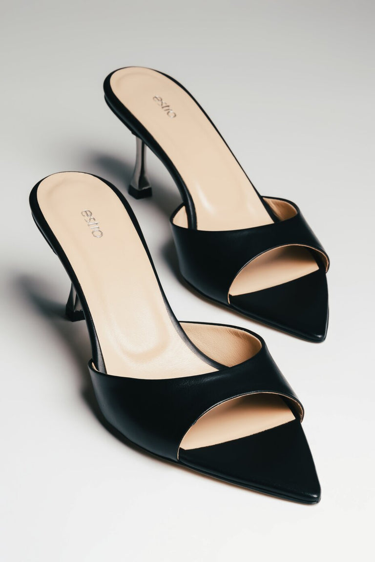 Angled side view of women's black leather mules with 7.5 cm heel