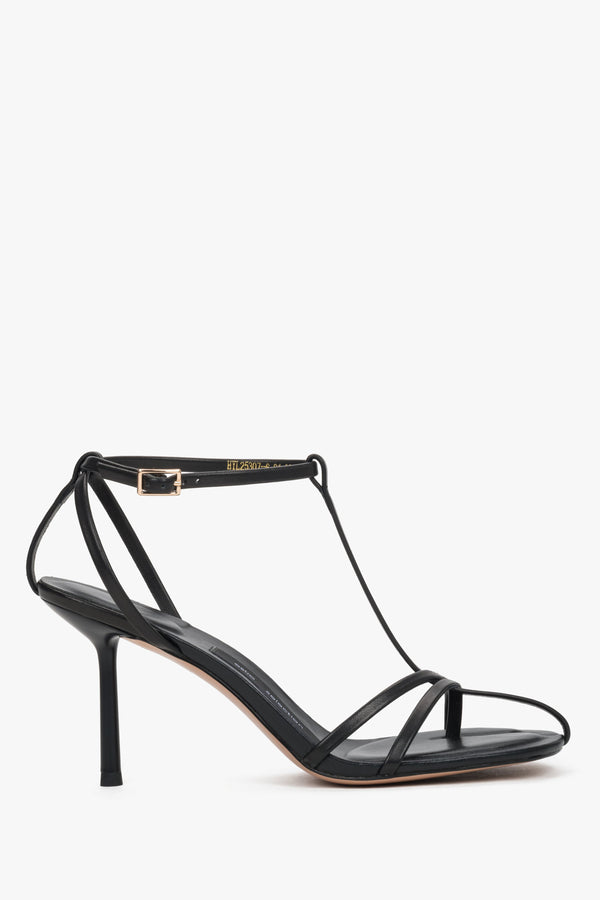Side view of women's black leather high heel sandals by Estro Selection