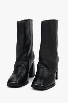 Black low women’s ankle boots Estro with a loose shaft made of natural leather.