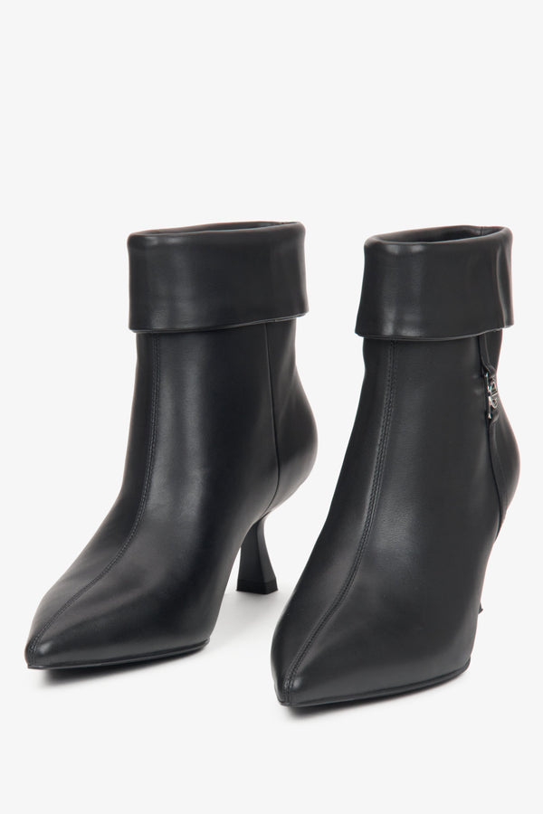 Black leather ankle boots for women featuring a low heel, designed by Estro.