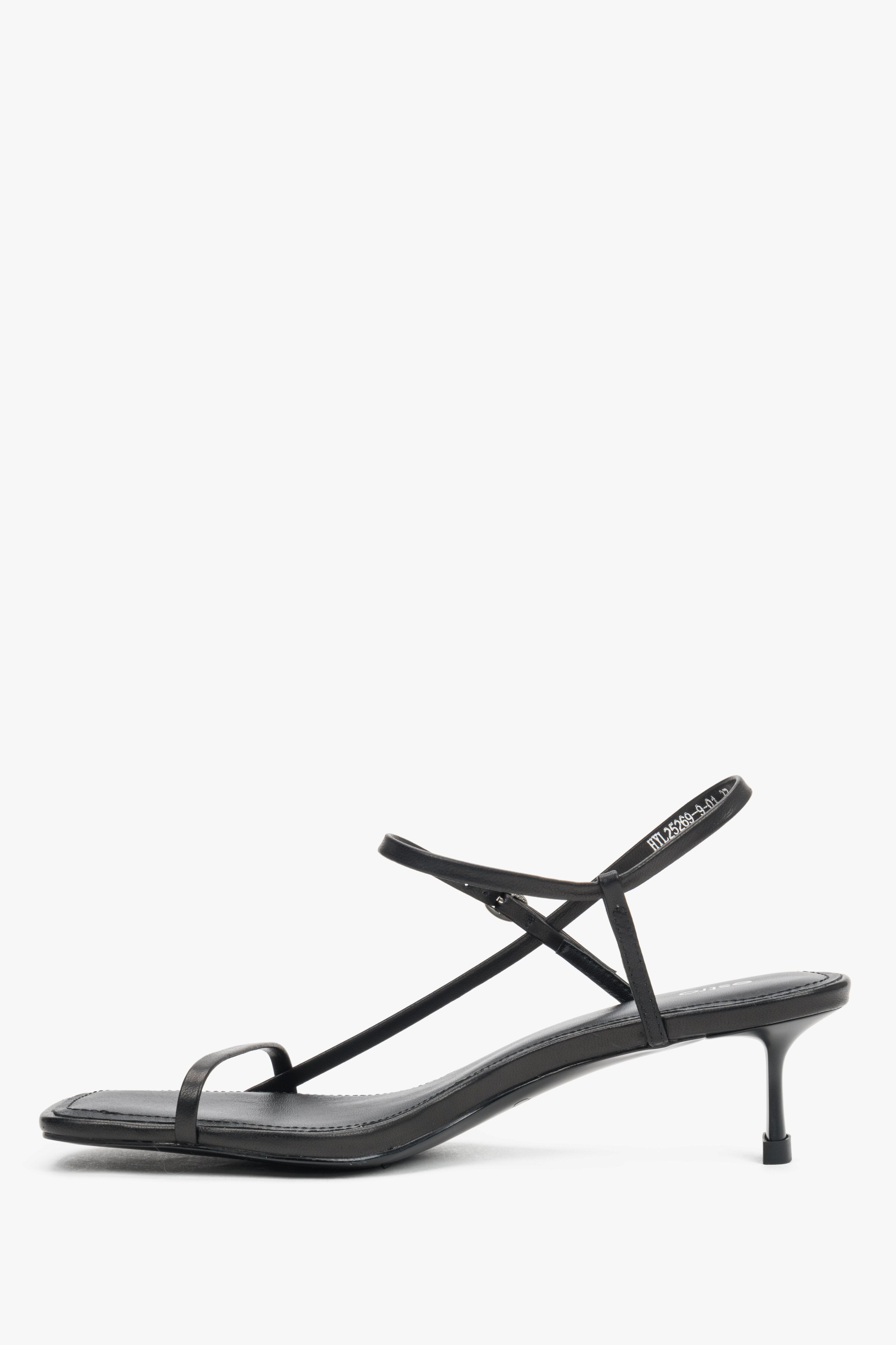 Women’s black leather low-heel sandals made of thin straps by Estro – side view.