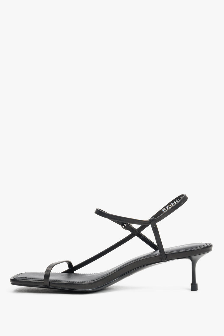 Women’s black leather low-heel sandals made of thin straps by Estro – side view.