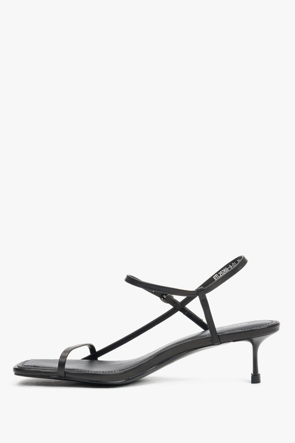 Women’s black leather low-heel sandals made of thin straps by Estro – side view.