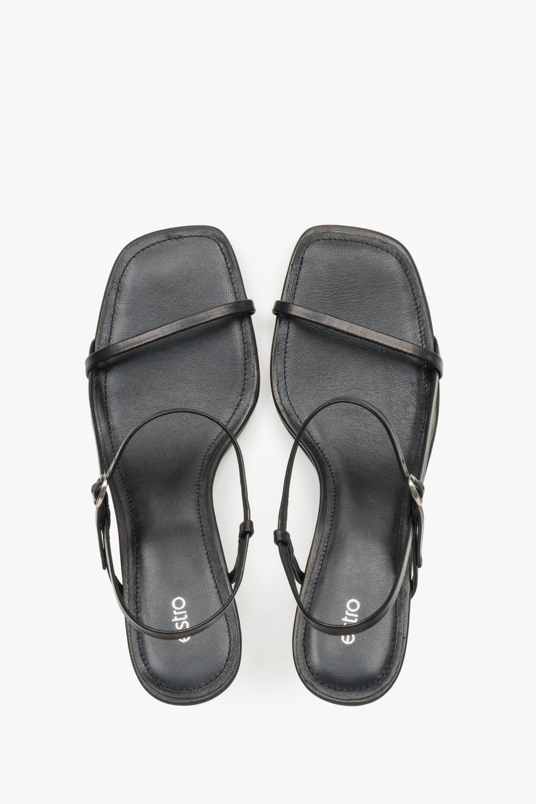Women’s black low-heel sandals made from genuine leather, featuring thin straps by Estro – top view.
