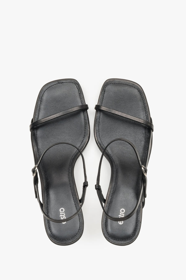 Women’s black low-heel sandals made from genuine leather, featuring thin straps by Estro – top view.