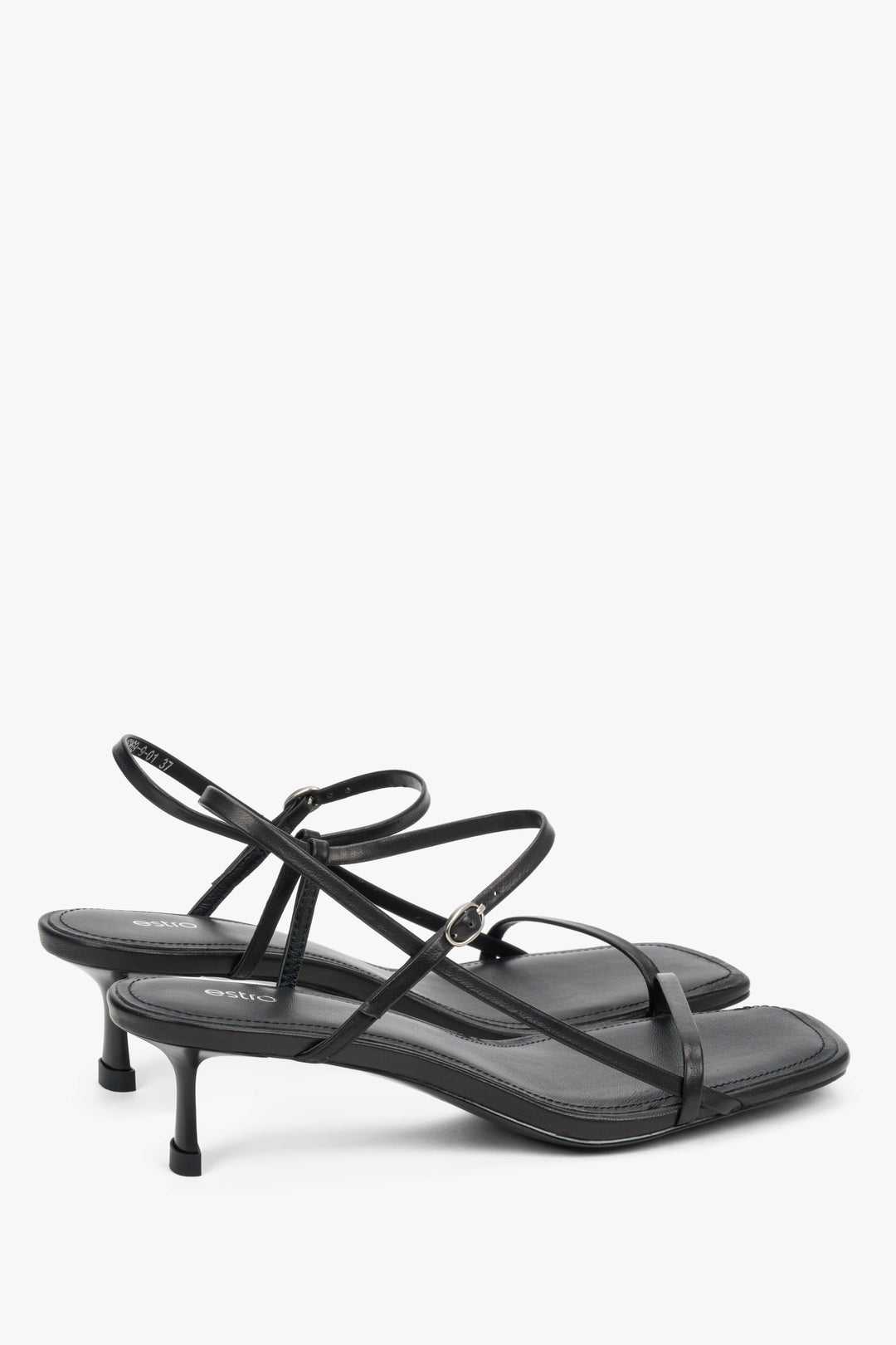 Women’s black leather low-heel sandals by Estro with thin straps.