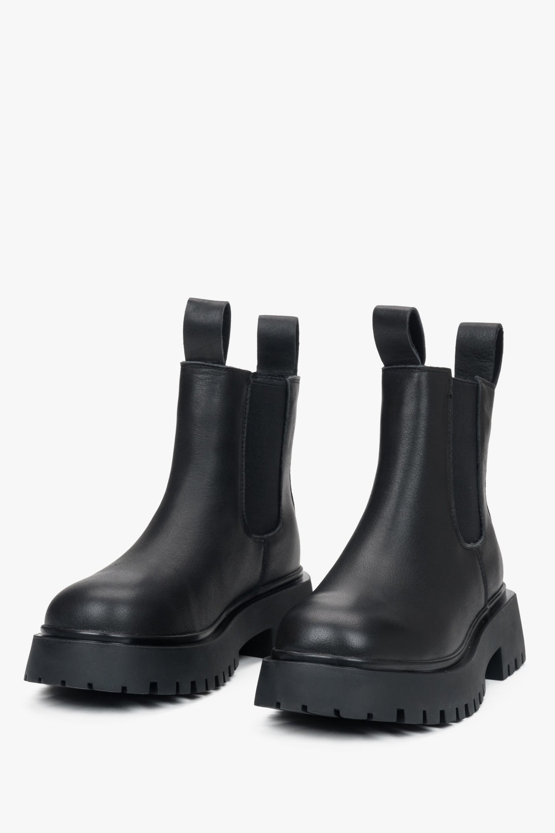 Black leather low-top Chelsea boots for women, designed by Estro.