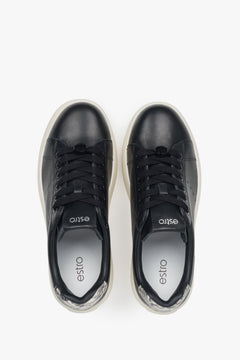 Chunky sole black leather low-top sneakers for women.