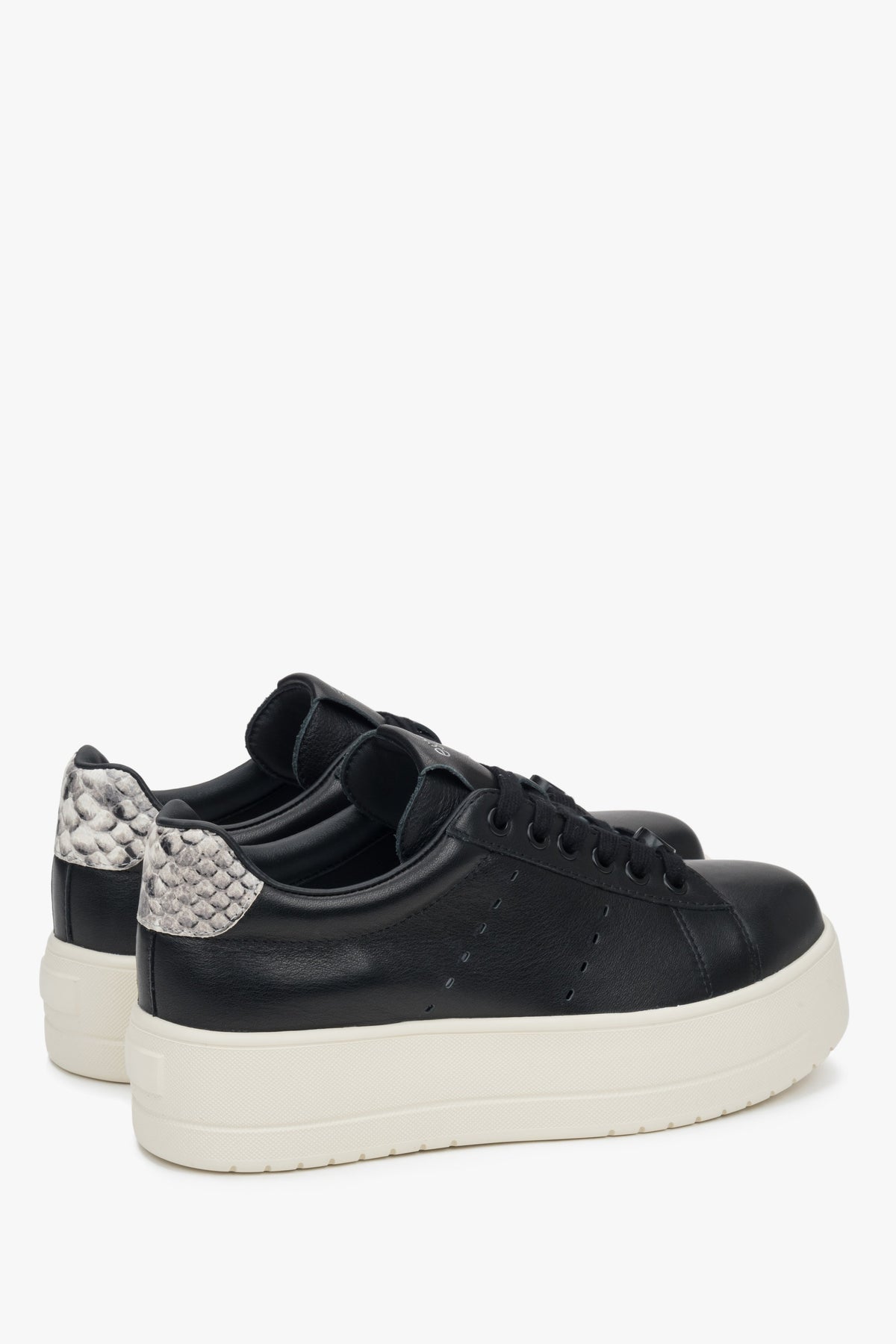Women's low-top sneakers in black leather with chunky sole.