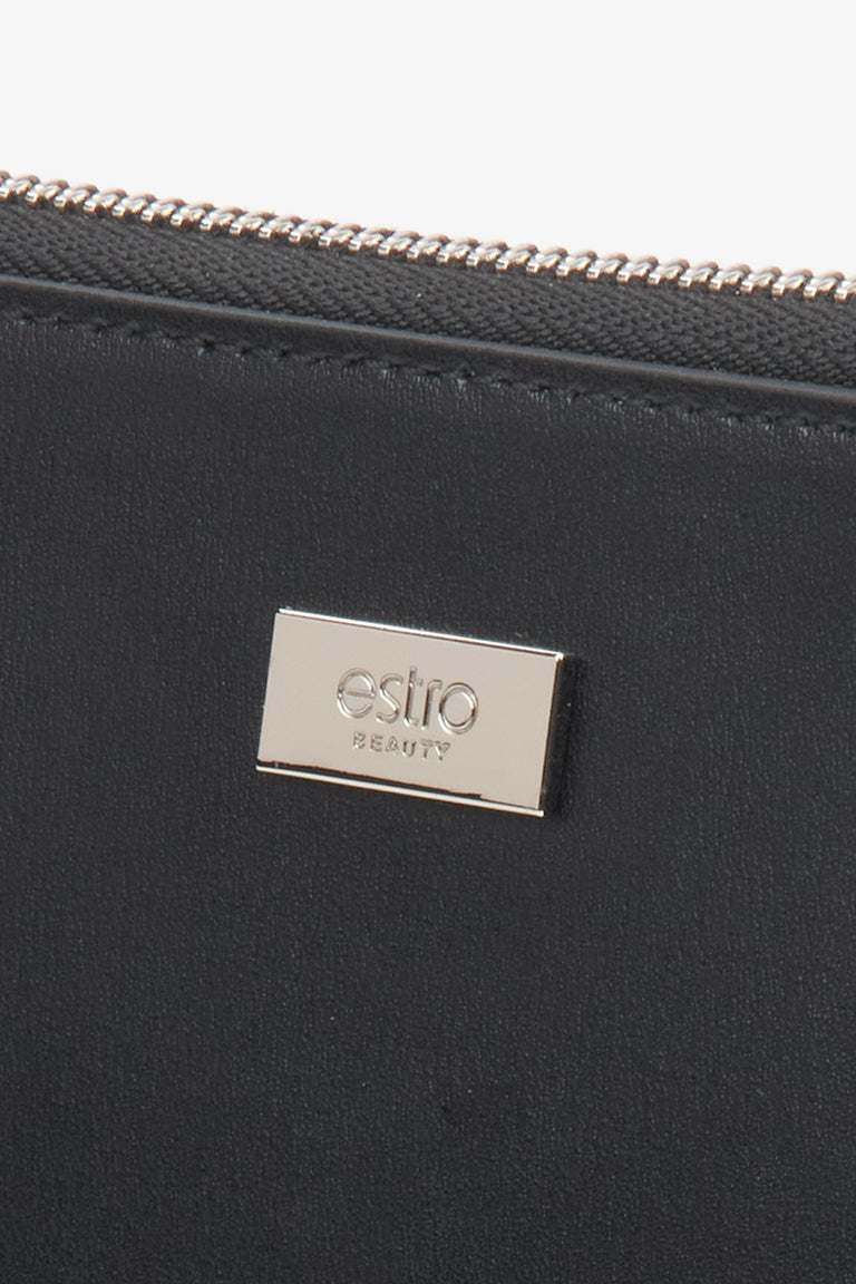 A women's black leather makeup bag, crafted by Estro - details.