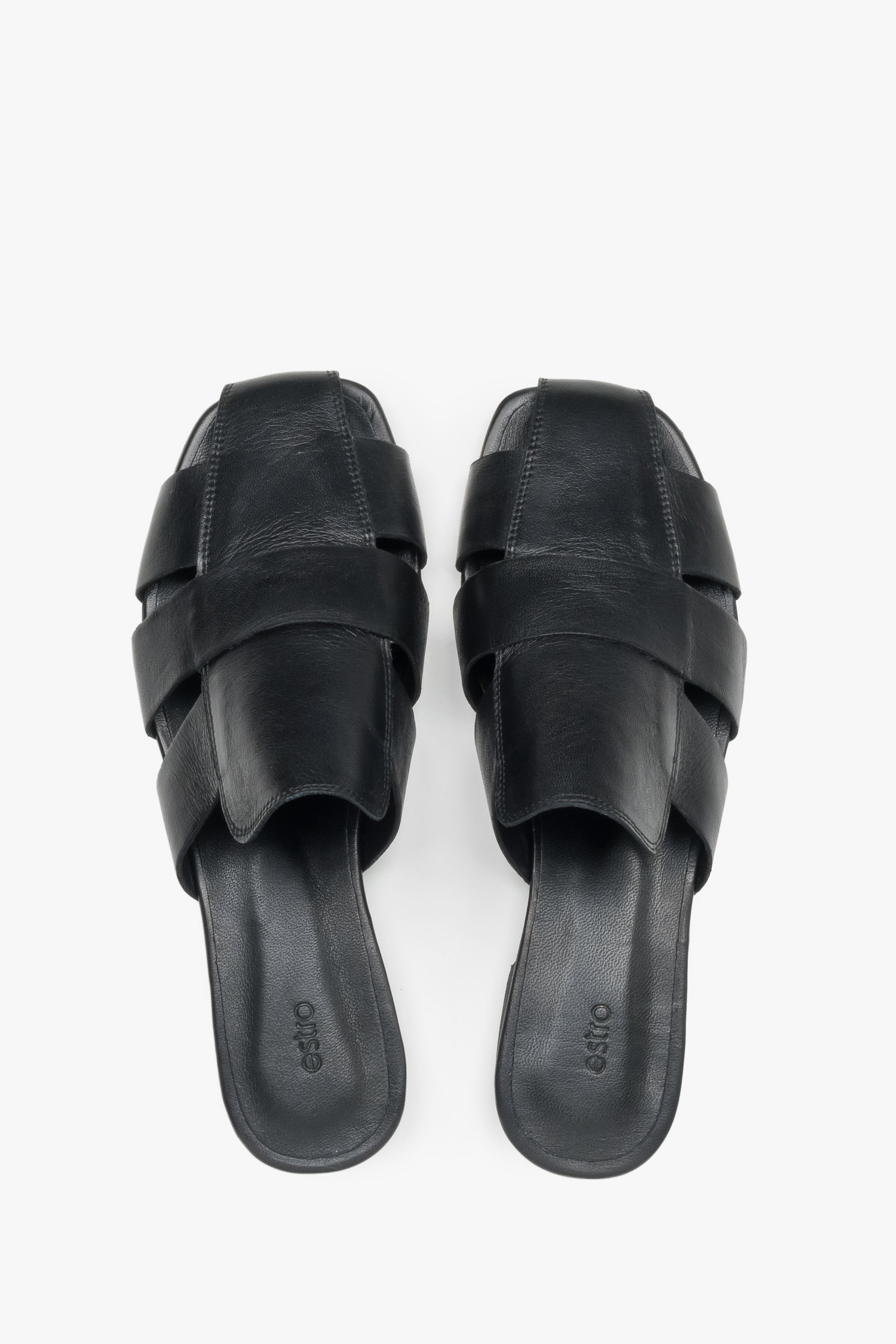 Backless pair of mules showcasing an interlaced front design, a fashionable square toe, and a smooth black insole featuring the brand logo.