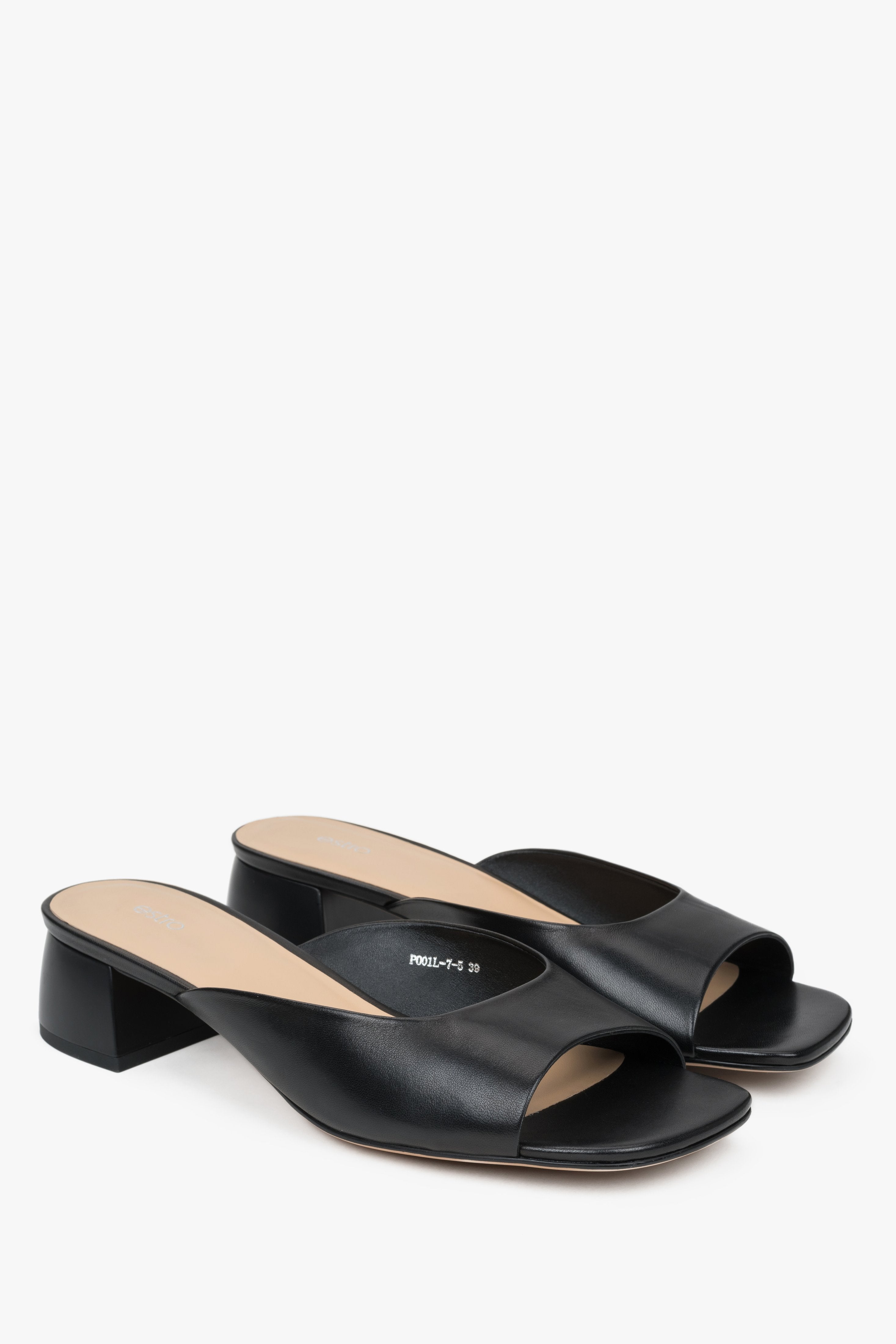Black women’s leather mules with low heel.