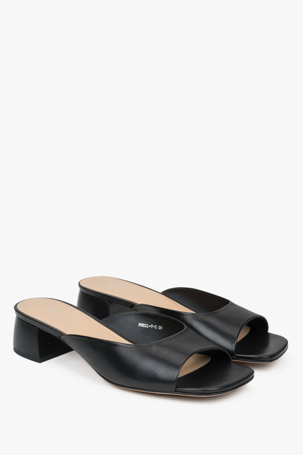 Black women’s leather mules with low heel.
