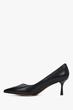 Side view of black leather low-heeled shoes.