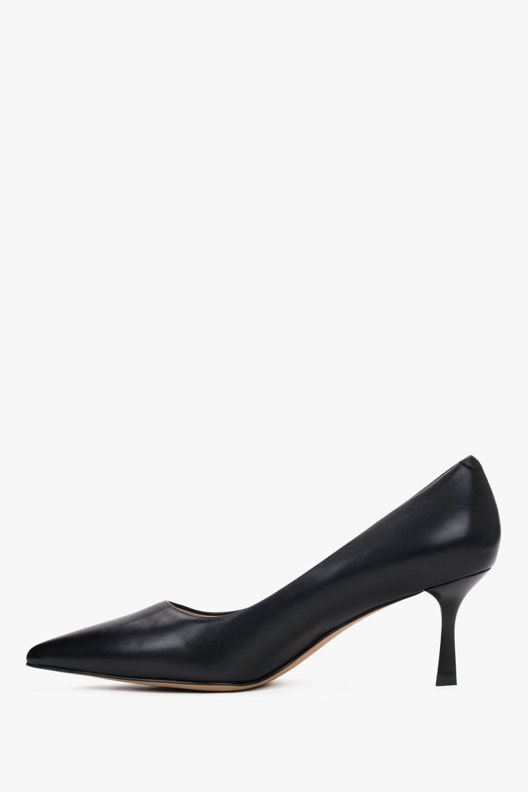 Side view of black leather low-heeled shoes.