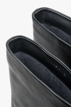 Black leather women's pointed-toe ankle boots with high stiletto heel, Estro.