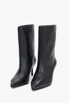 Women's black leather stiletto ankle boots Estro - front view showing the sharp pointed toe and sleek leather finish.