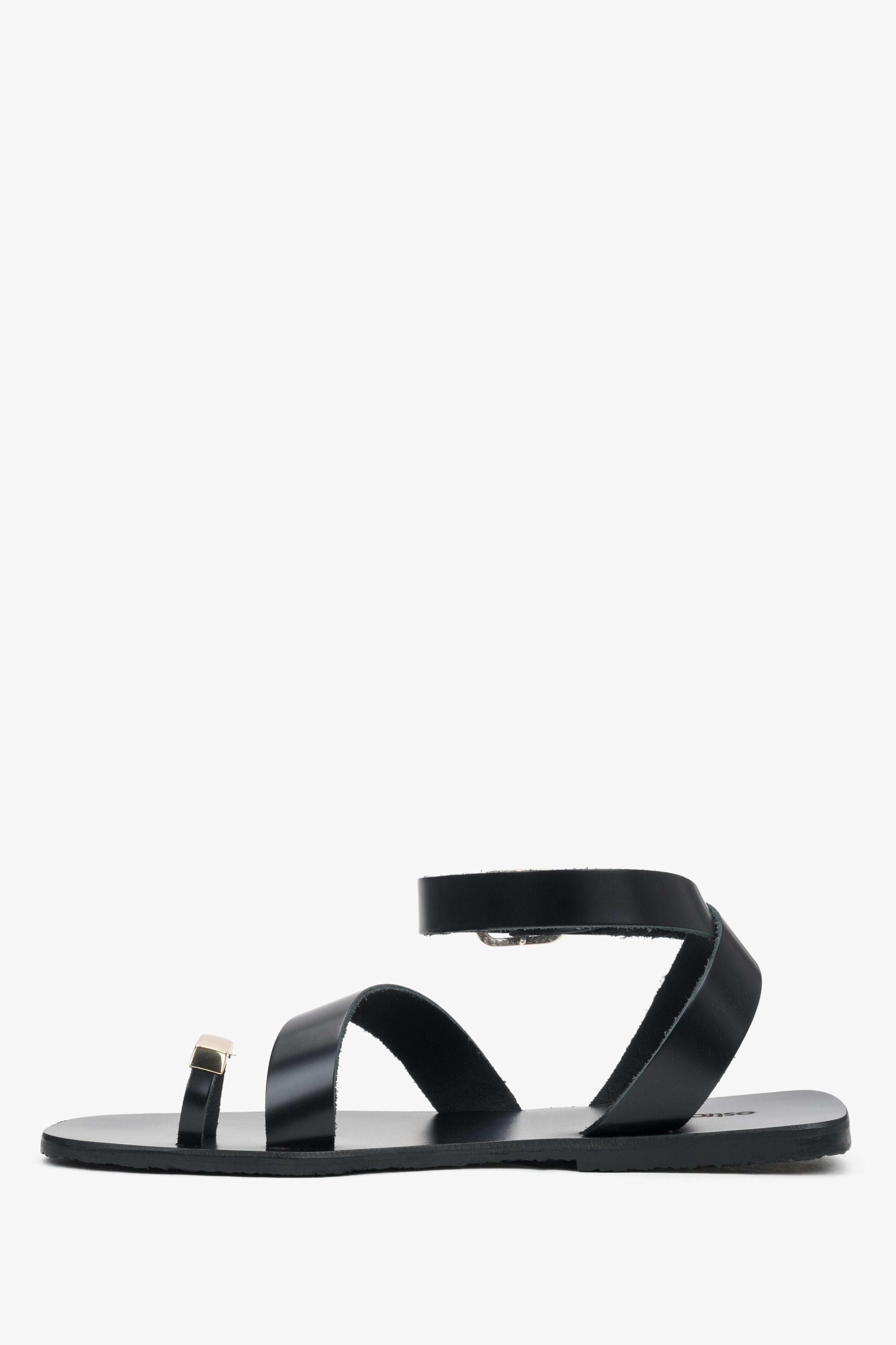 Women’s black leather sandals with a decorative toe ring by Estro – side view.