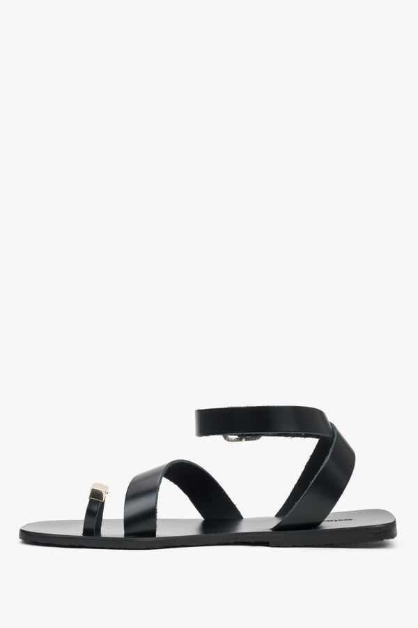 Women’s black leather sandals with a decorative toe ring by Estro – side view.
