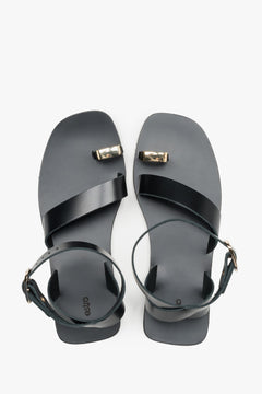 Women’s black leather sandals with a decorative toe ring by Estro - top view.