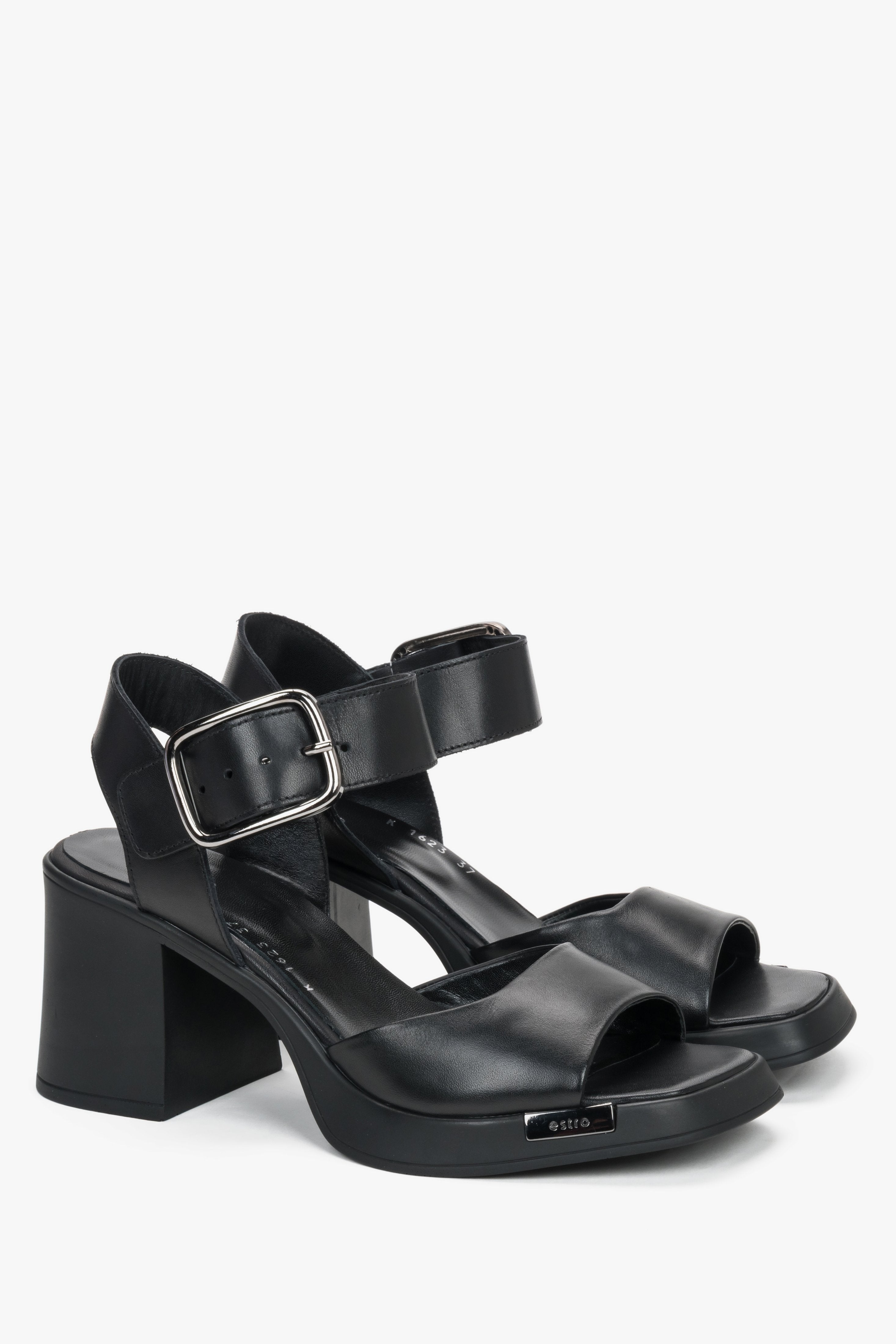 Black leather women’s sandals on a stable block heel with thick straps.