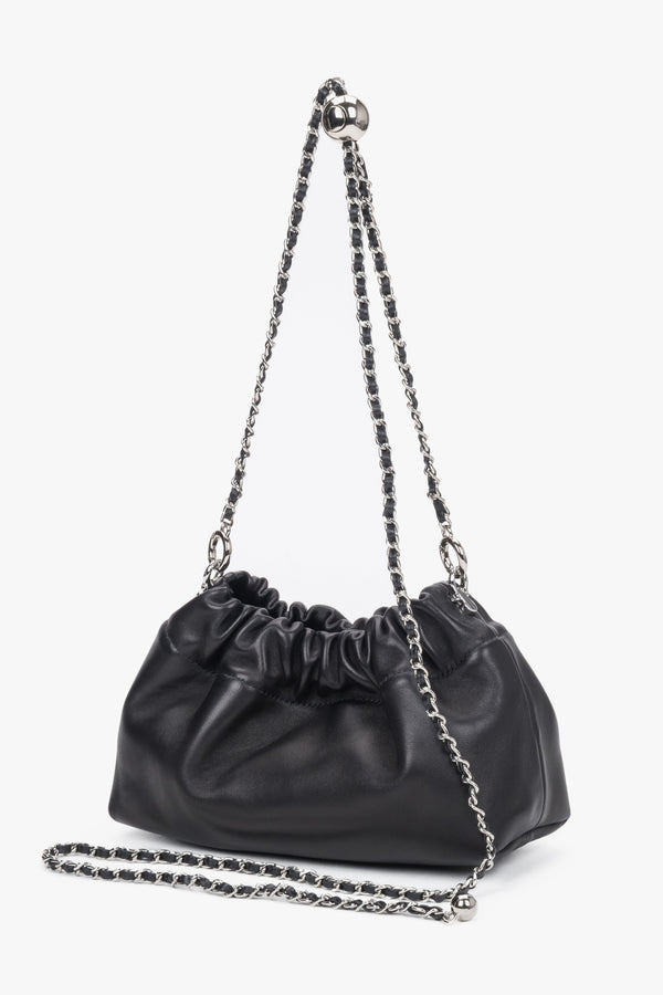 Front view of women's black leather shoulder bag with chain