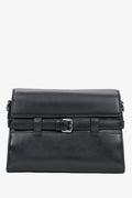 Women's black leather shoulder bag with decorative buckle by Estro