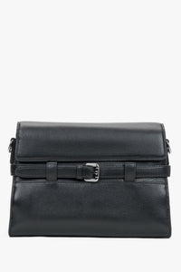 Women's black leather shoulder bag with decorative buckle by Estro