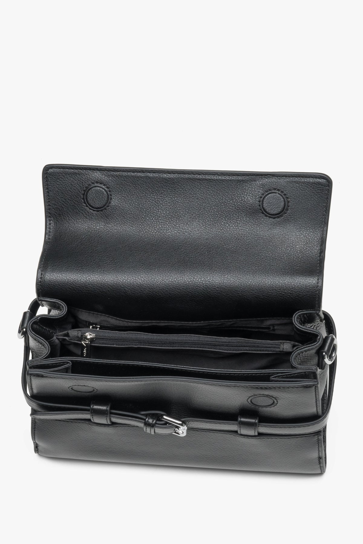 Interior view of women's black leather shoulder bag with compartments