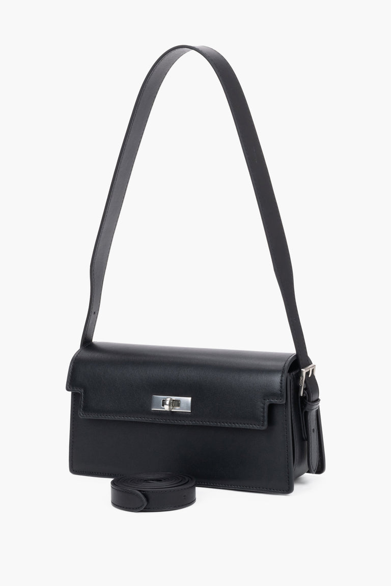 Front view of women's black leather shoulder bag by Estro