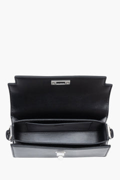 Interior view of women's black leather shoulder bag by Estro