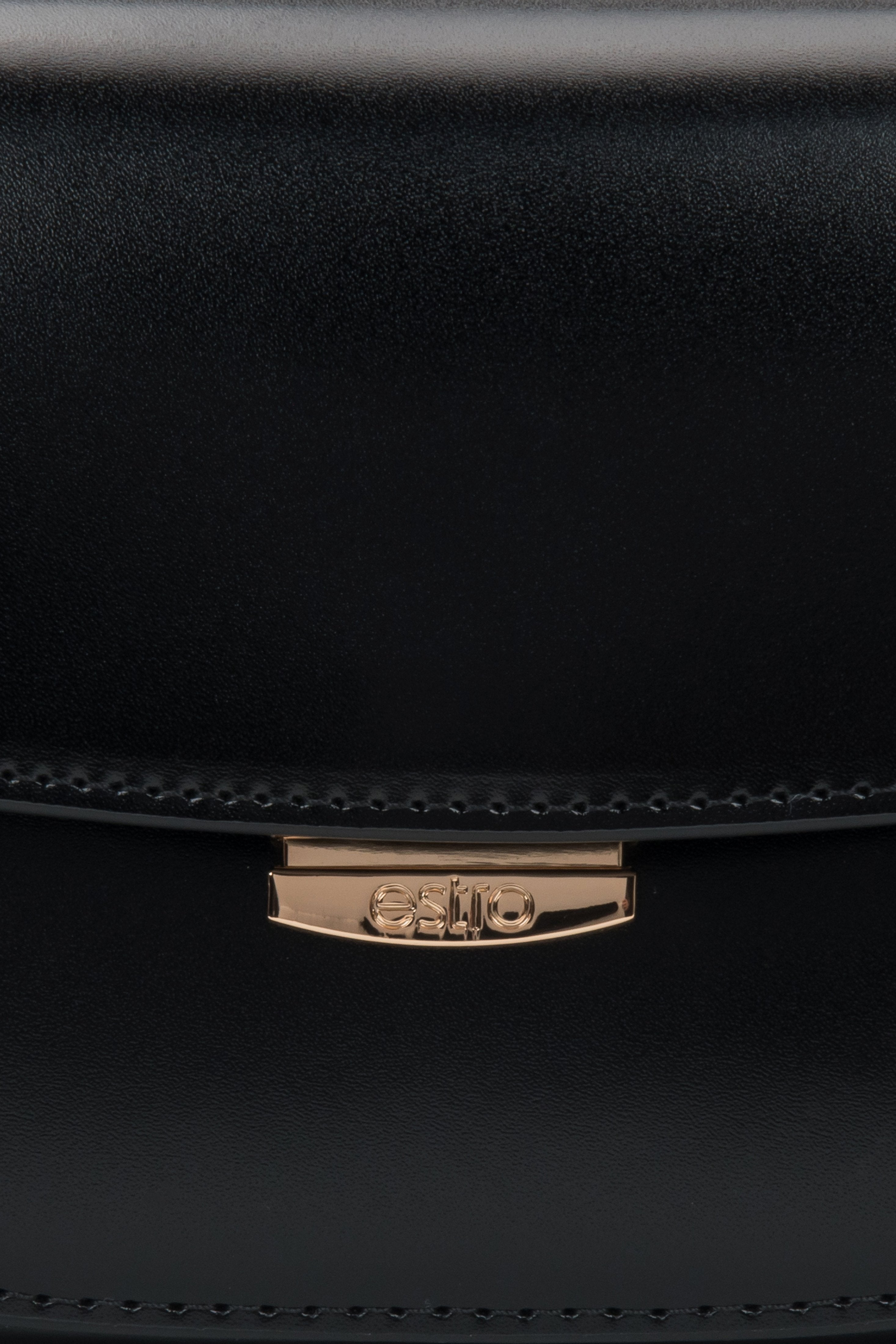 Timeless black leather bag with structured silhouette, perfect for everyday and evening looks.