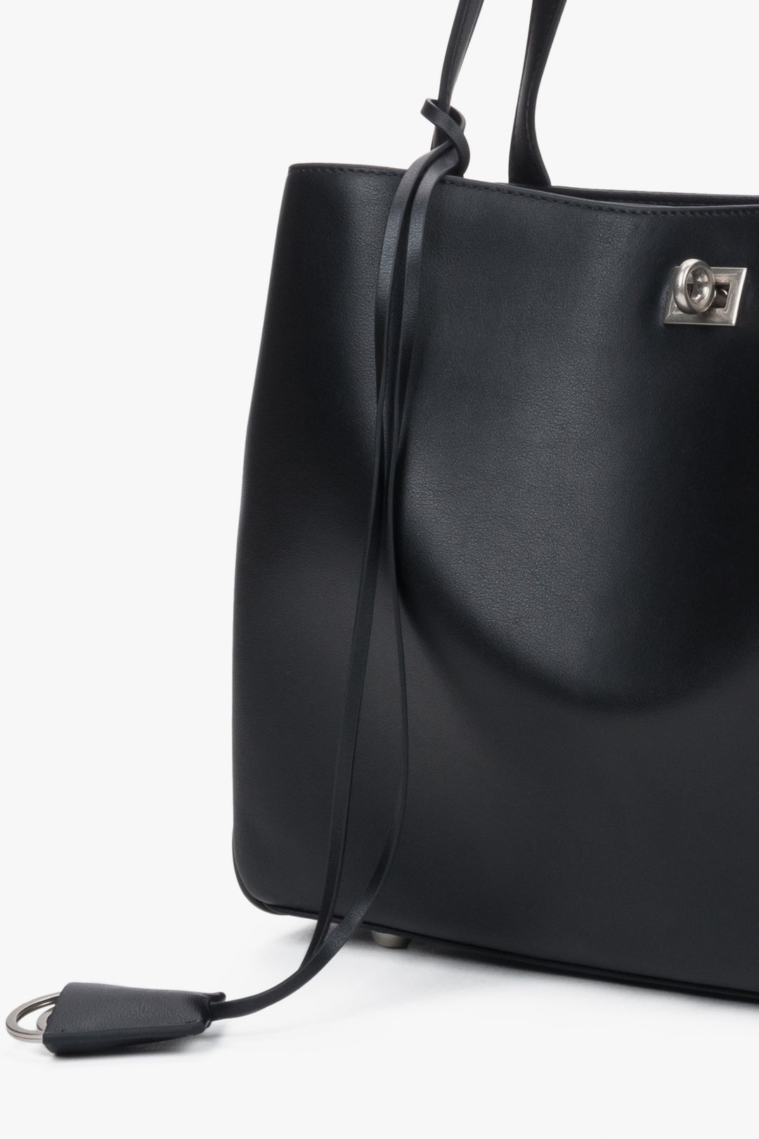 Detail view of women's black leather shoulder bag handle by Estro