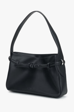 Compact yet functional design with a secure zip closure and refined finish.
