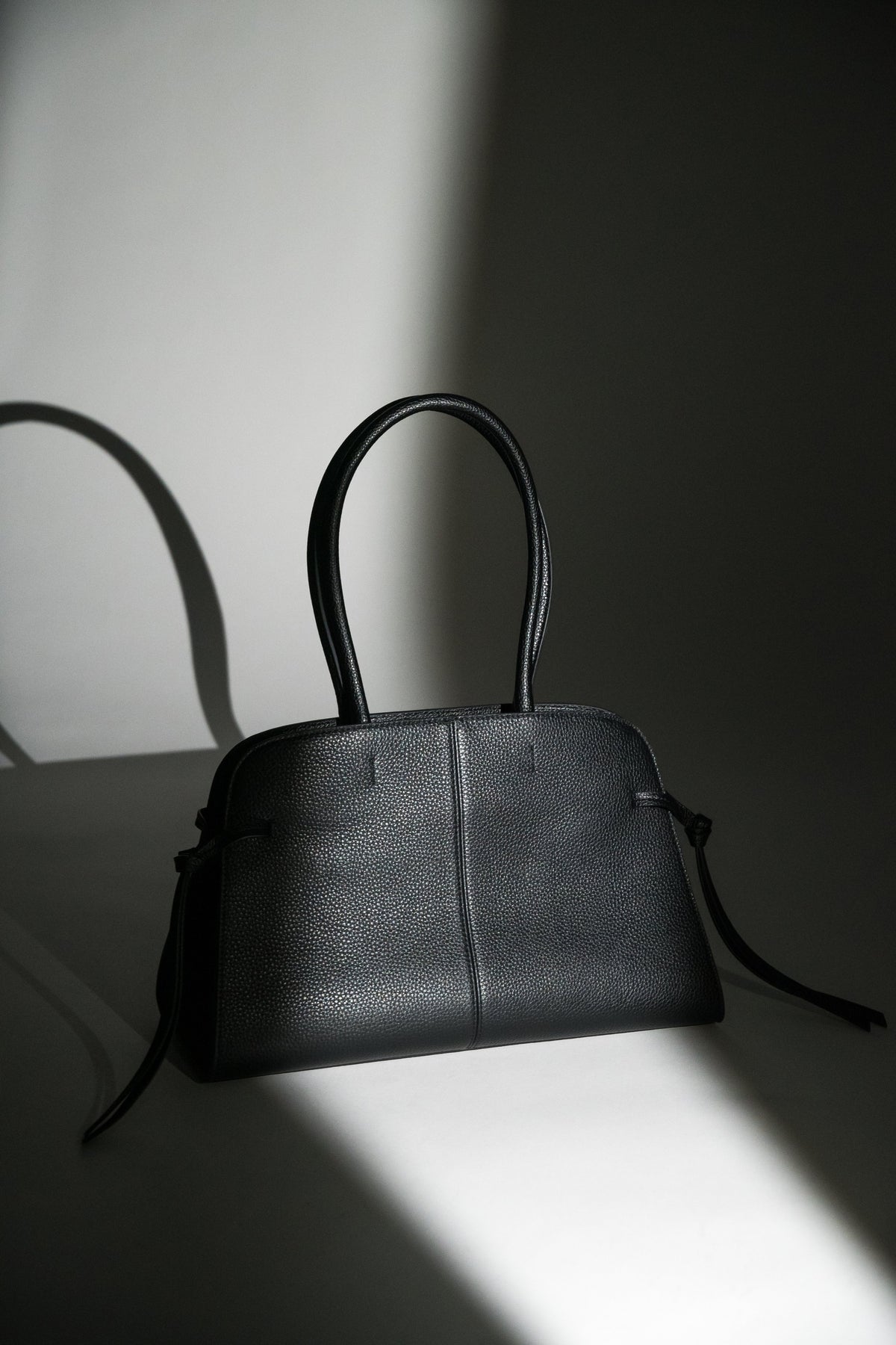 Women's Black Leather Shoulder Bowler Bag with Side Lacing Estro ER00120557.