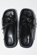 Women's black leather slide sandals with silver buckles by Estro